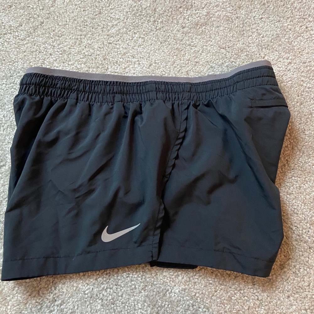Brand new Nike women’s running shorts dark grey